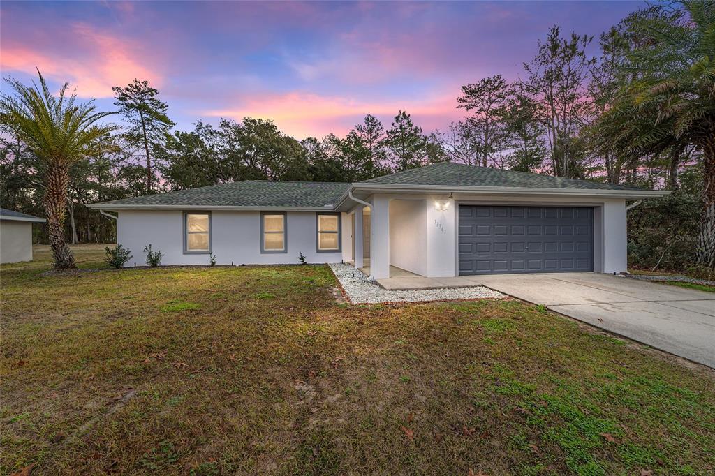 13361 60th Court Road Ocala, FL 34473 - Photo 1 of 1 a backyard of a house with table and chairs