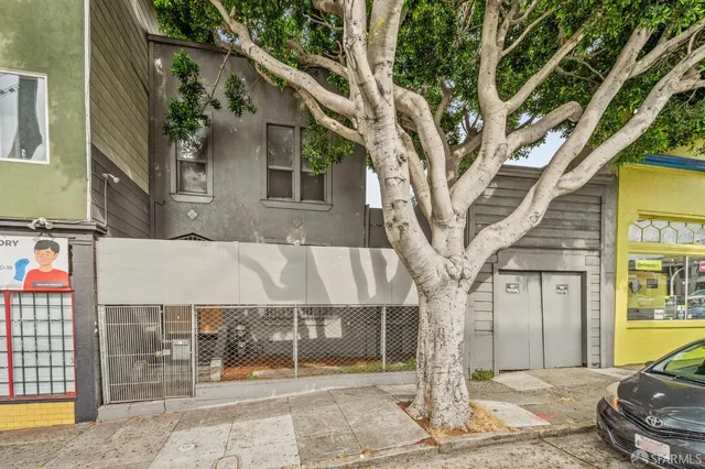 a front view of a building with street view