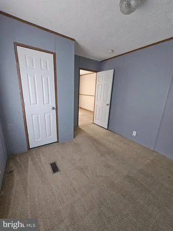 a view of an empty room and a window