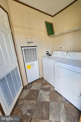 a view of a hallway with washer and dryer
