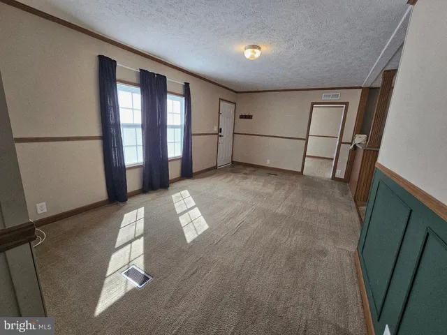a view of livingroom with hardwood floor and window