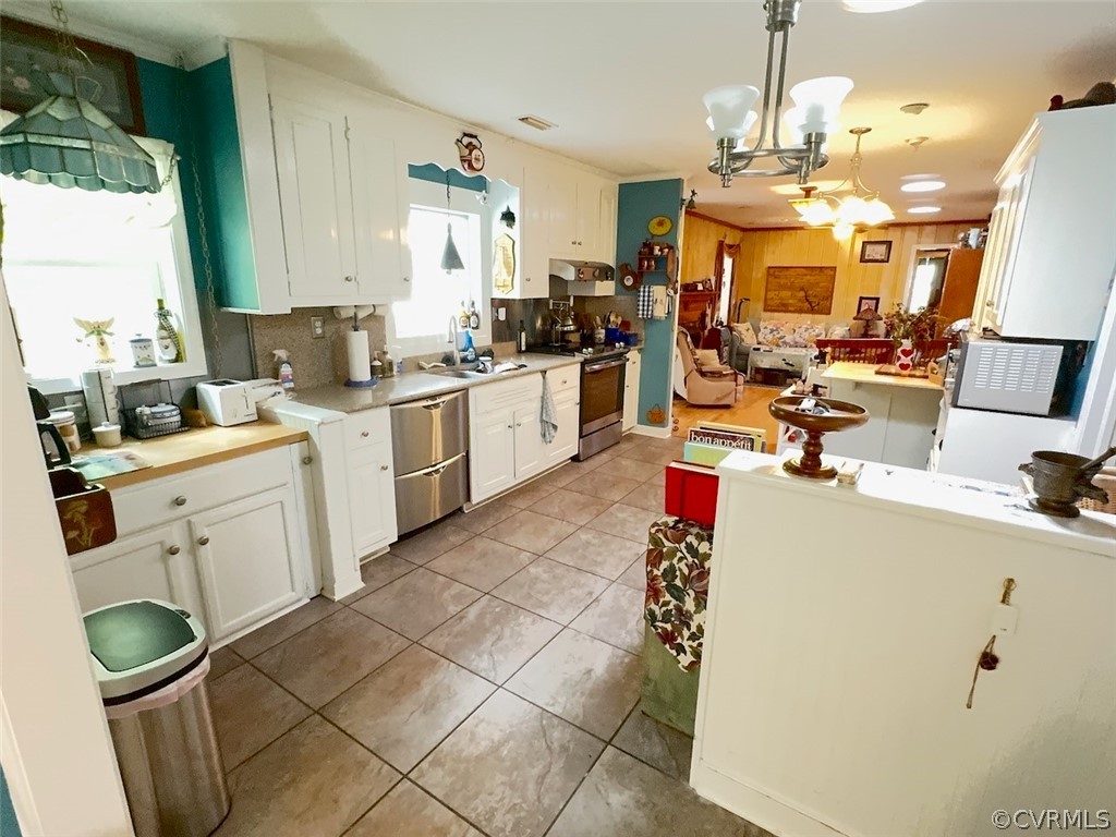 12001 Sunset Drive Ashland, VA 23005 - Photo 12 of 40 a kitchen with a sink a stove cabinets and counter space
