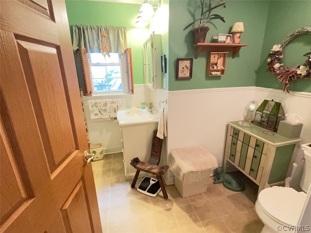 12001 Sunset Drive Ashland, VA 23005 - Photo 14 of 40 a bathroom with a sink mirror vanity and toilet