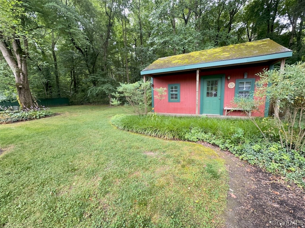 12001 Sunset Drive Ashland, VA 23005 - Photo 26 of 40 a front view of a house with garden