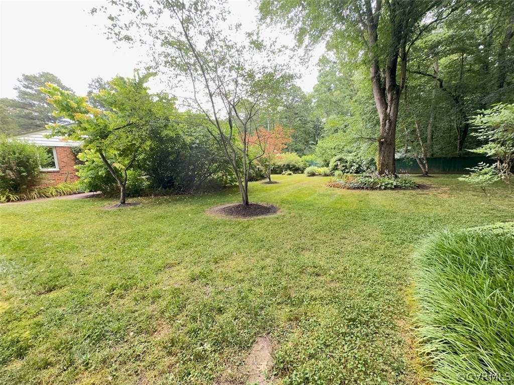 12001 Sunset Drive Ashland, VA 23005 - Photo 27 of 40 a backyard of a house with lots of green space and fountain