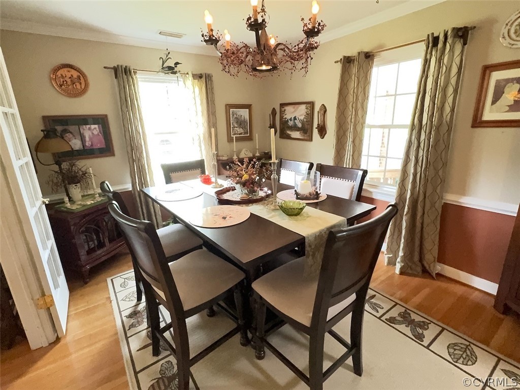 12001 Sunset Drive Ashland, VA 23005 - Photo 6 of 40 a view of a dining room with furniture window and wooden floor