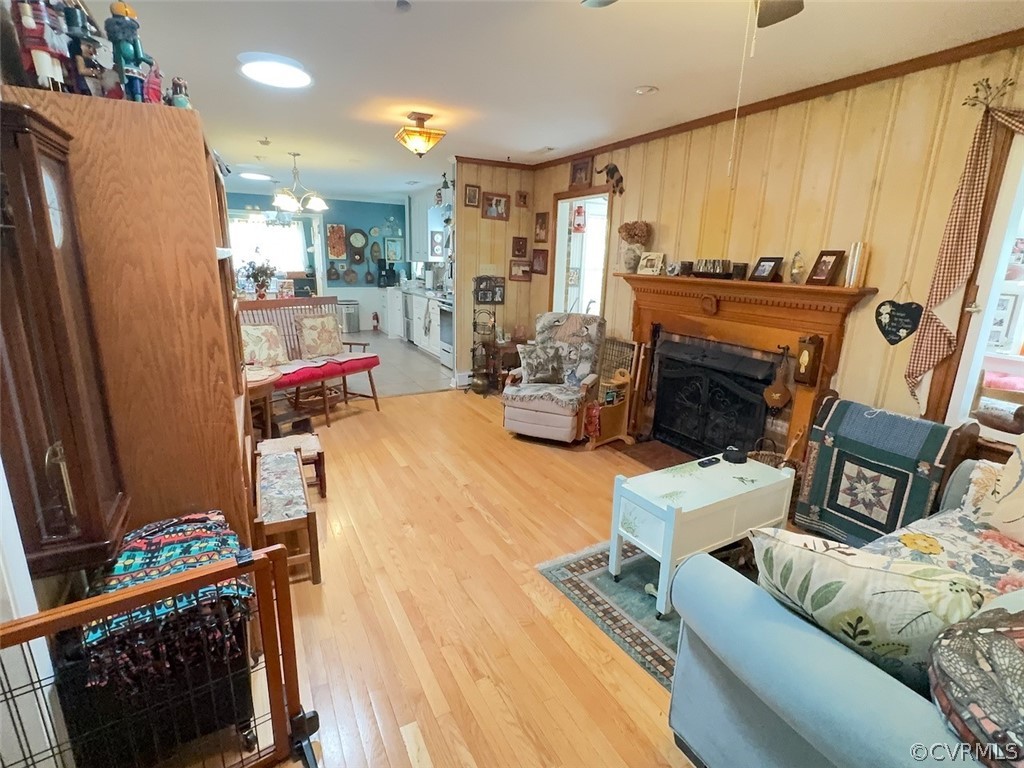 12001 Sunset Drive Ashland, VA 23005 - Photo 7 of 40 a living room with furniture a fireplace and a flat screen tv