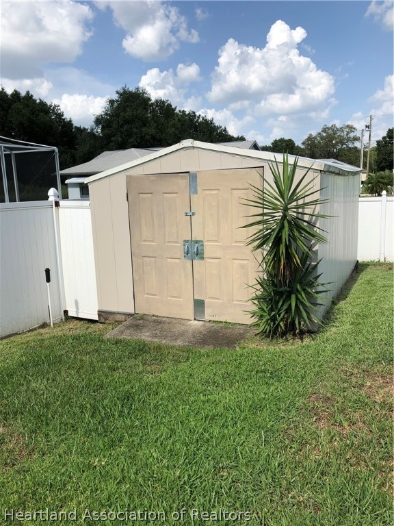 4440 Mandarin Road Sebring, FL 33875 - Photo 14 of 17 a view of a backyard