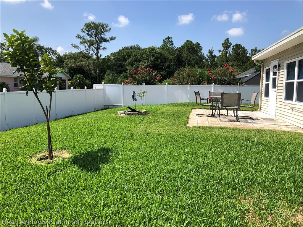 4440 Mandarin Road Sebring, FL 33875 - Photo 16 of 17 a house view with a garden space