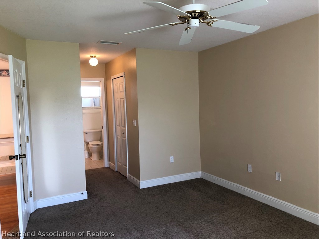 4440 Mandarin Road Sebring, FL 33875 - Photo 7 of 17 wooden floor in an empty room