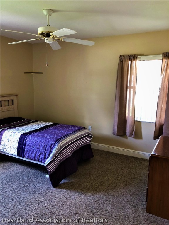 4440 Mandarin Road Sebring, FL 33875 - Photo 9 of 17 a bedroom with a bed and window