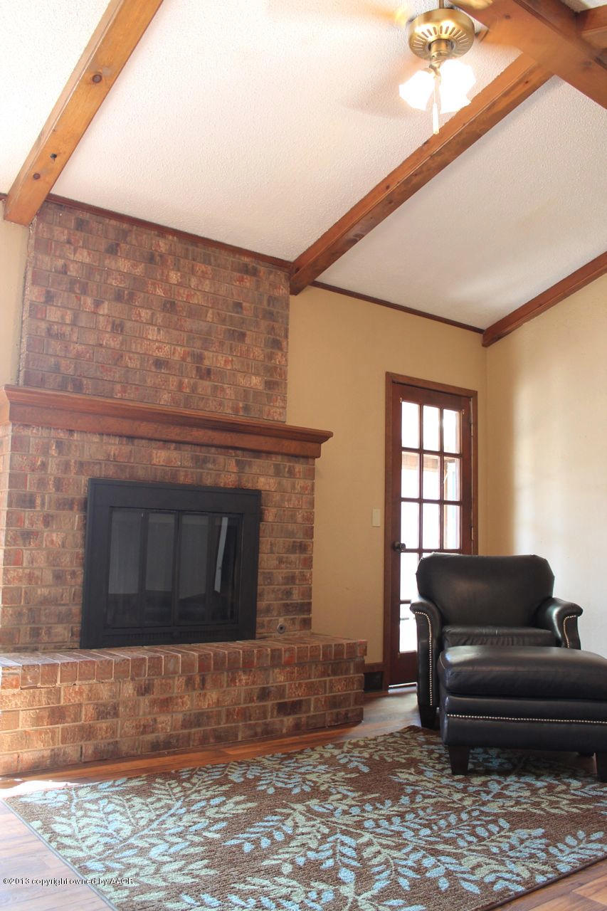 5130 McCarty Boulevard Amarillo, TX 79110 - Photo 4 of 26 a living room with furniture and a fireplace