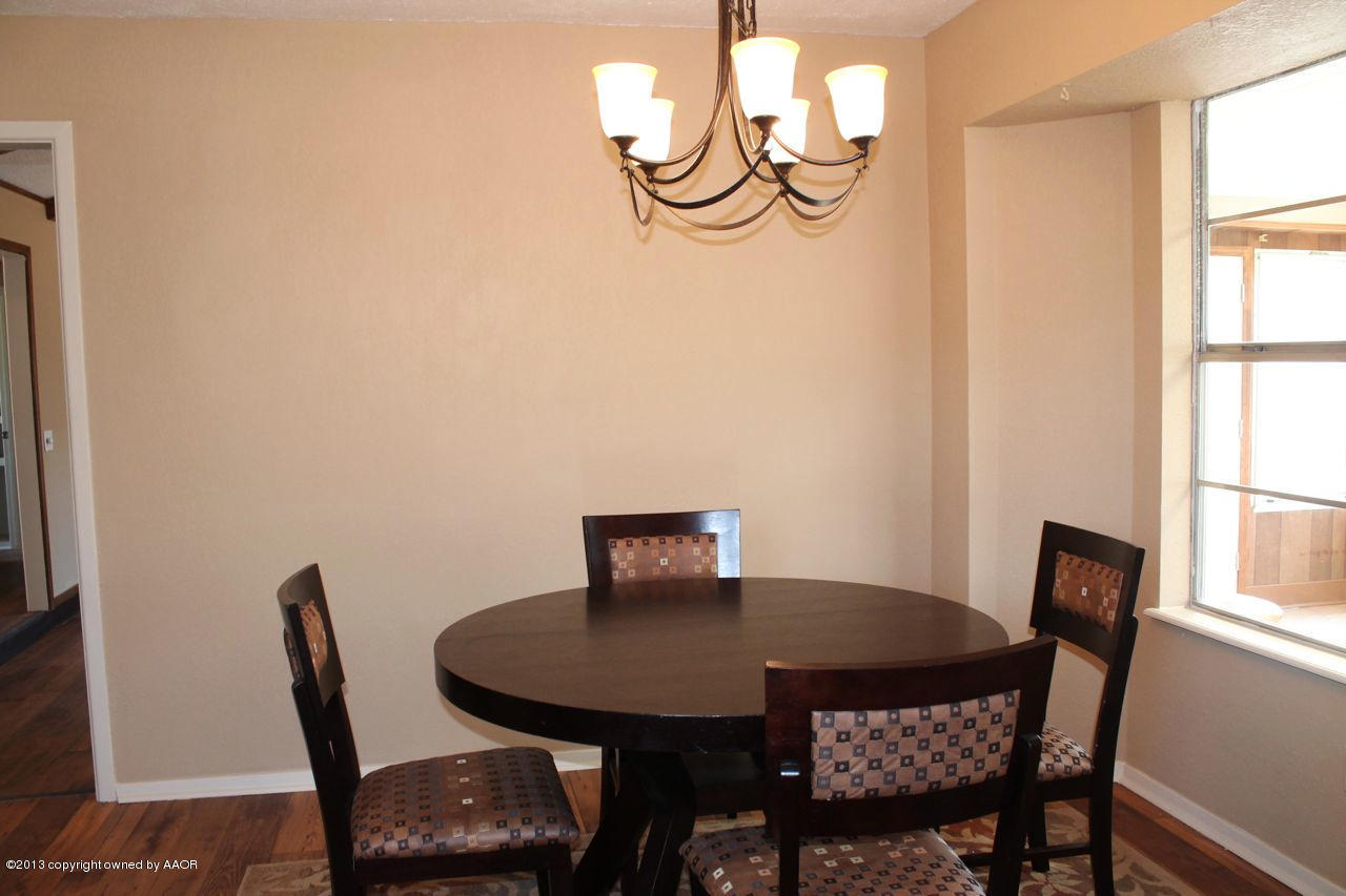 5130 McCarty Boulevard Amarillo, TX 79110 - Photo 8 of 26 a view of a dining room with furniture and window