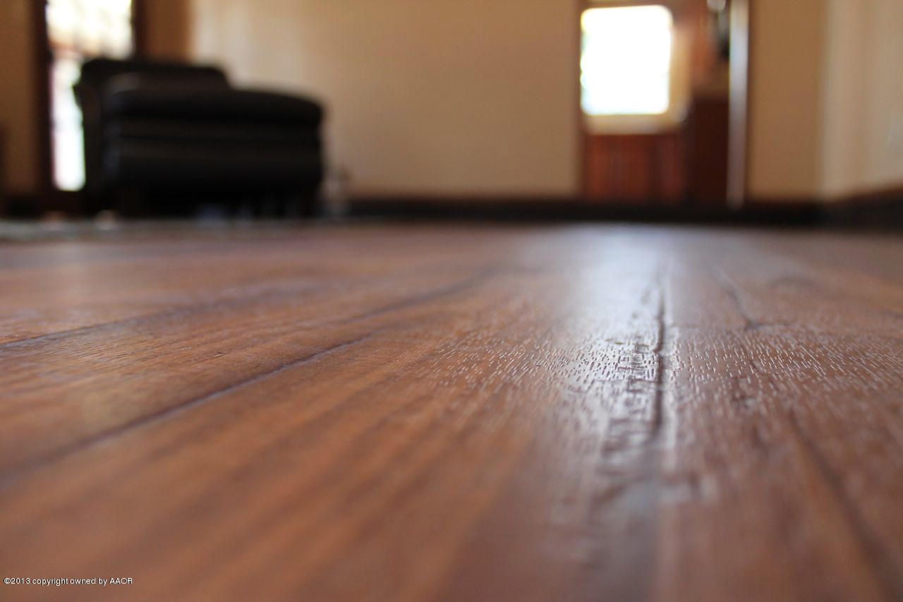 5130 McCarty Boulevard Amarillo, TX 79110 - Photo 9 of 26 a view of a livingroom with wooden floor and a window
