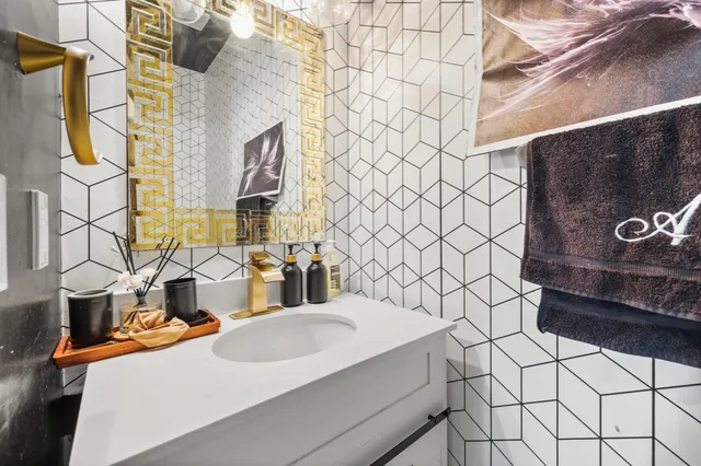 a bathroom with a sink and a mirror