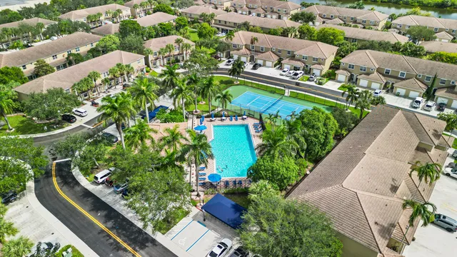 an aerial view of residential houses with outdoor space
