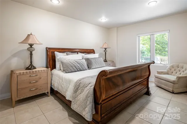 a bedroom with a bed and a couch