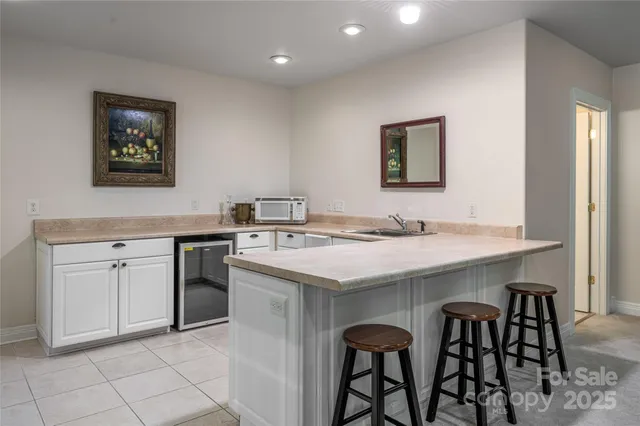 a kitchen with granite countertop a sink and appliances