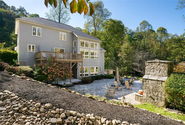 a view of a patio with table and chairs and potted plants