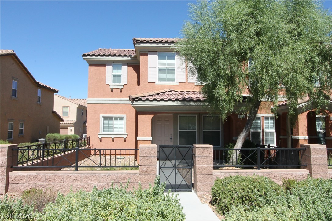 3188 Mist Effect Avenue Henderson, NV 89044 - Photo 1 of 1 A terracotta-hued facade with classic tile roofing offers charming curb appeal.