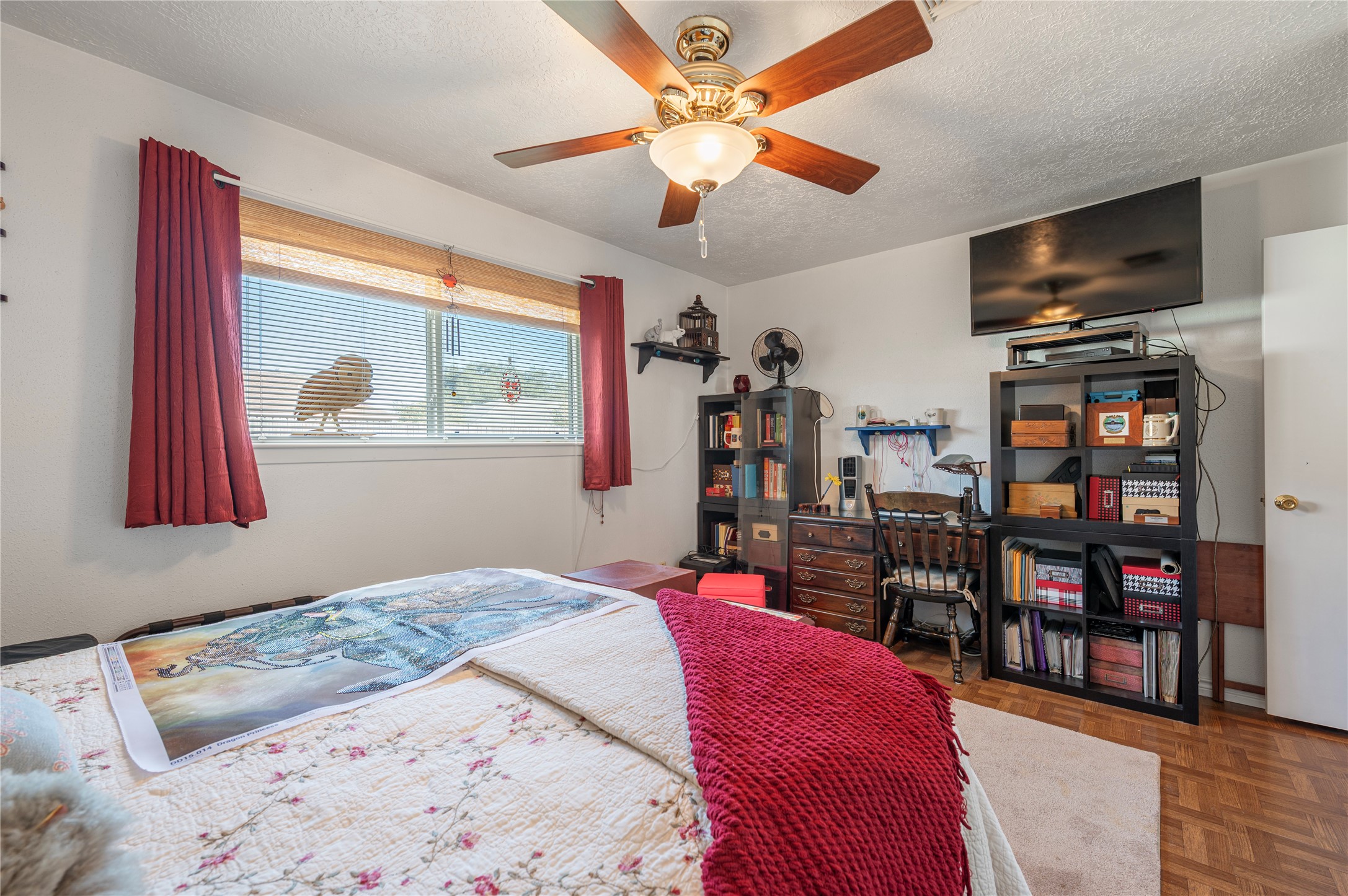 10107 Rocky Hollow Road La Porte, TX 77571 - Photo 20 of 33 a bedroom with a bed a flat screen tv and a window