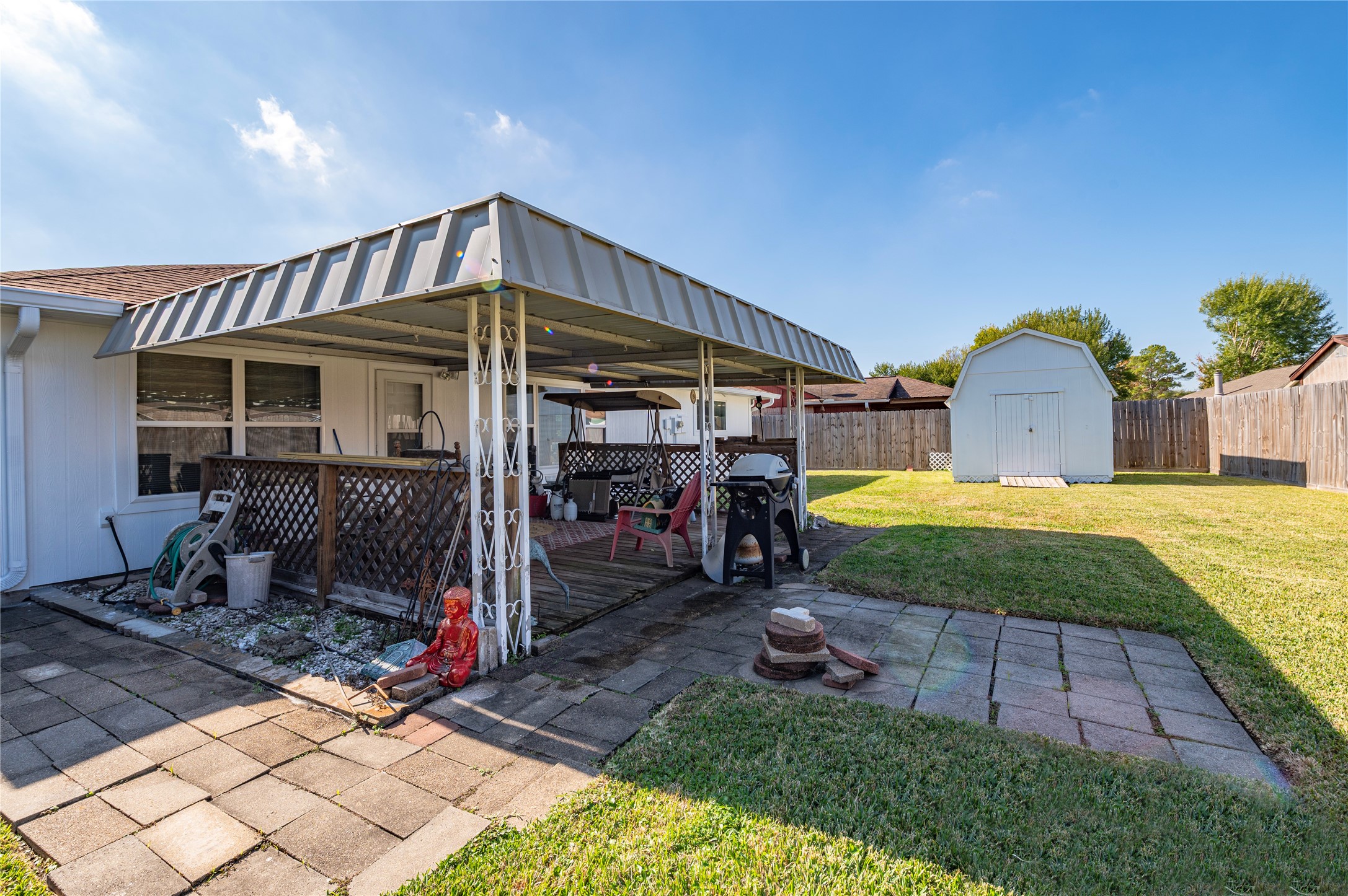 10107 Rocky Hollow Road La Porte, TX 77571 - Photo 28 of 33 a view of a house with a yard porch and furniture