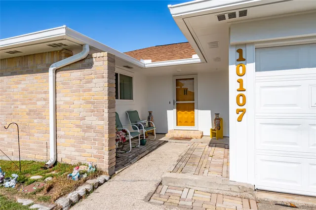 a view of the front door and the trees
