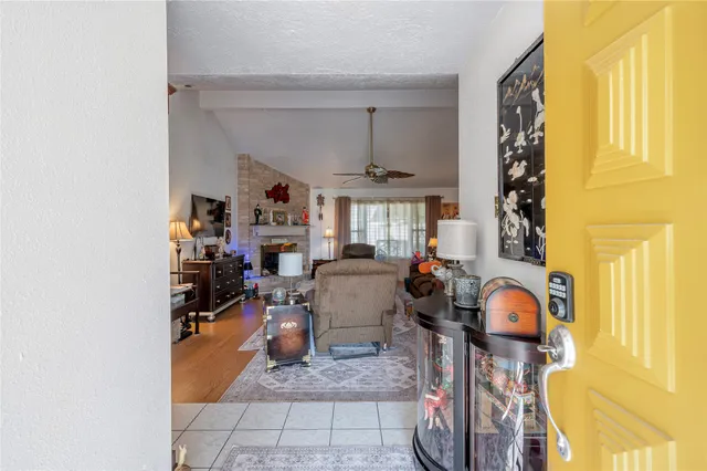 a view of living room filled with furniture and a window