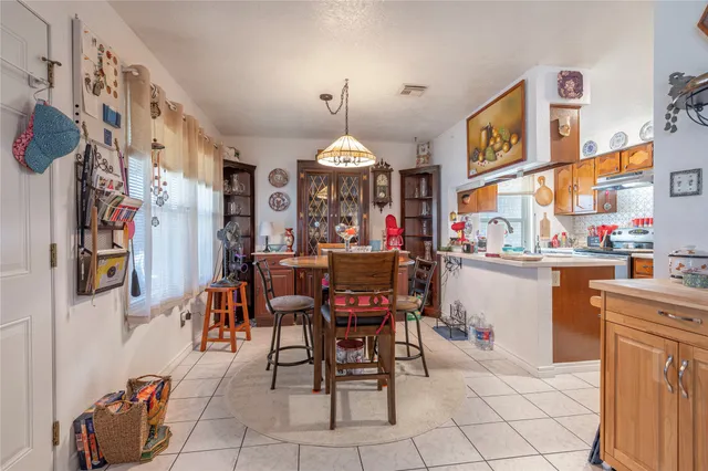 a dining room with furniture and window