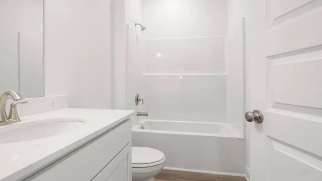 a bathroom with a sink and mirror