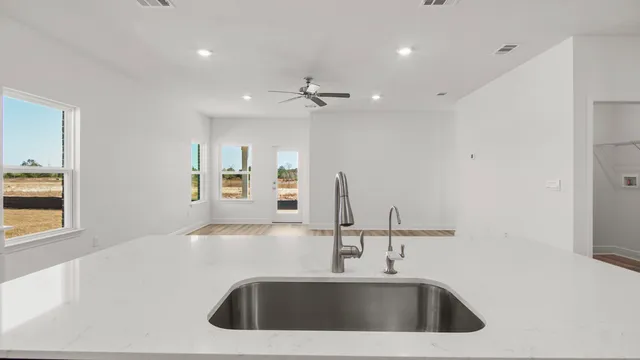 a view of a hallway with wooden floor and closet