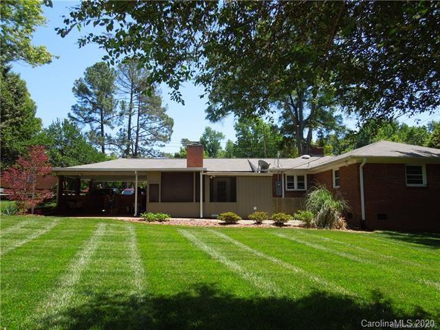 5531 Hickory Grove Road Charlotte, NC 28215 - Photo 2 of 24 a view of a house with a backyard porch and sitting area
