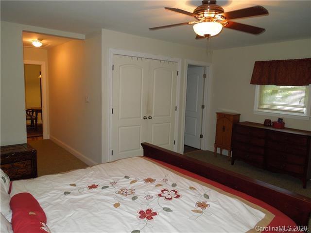 5531 Hickory Grove Road Charlotte, NC 28215 - Photo 12 of 24 a bedroom with a bed and wooden floor