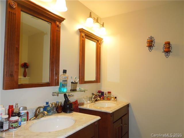 5531 Hickory Grove Road Charlotte, NC 28215 - Photo 14 of 24 a bathroom with a sink vanity and a mirror