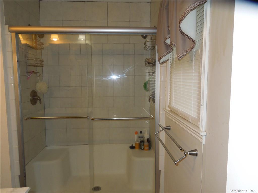 5531 Hickory Grove Road Charlotte, NC 28215 - Photo 16 of 24 a bathroom with a shower