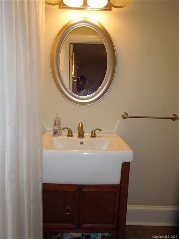 5531 Hickory Grove Road Charlotte, NC 28215 - Photo 18 of 24 a close view of a sink and a washer and dryer