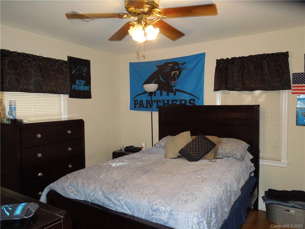 5531 Hickory Grove Road Charlotte, NC 28215 - Photo 20 of 24 a bedroom with a bed and a closet
