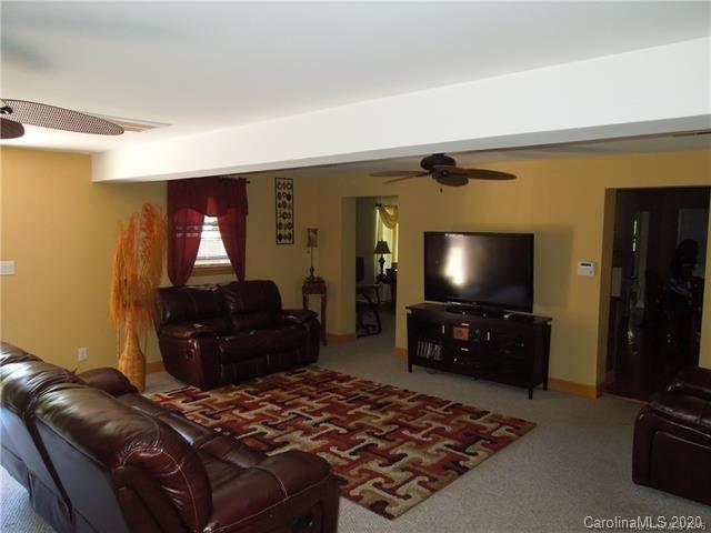 5531 Hickory Grove Road Charlotte, NC 28215 - Photo 6 of 24 a living room with furniture and a flat screen tv