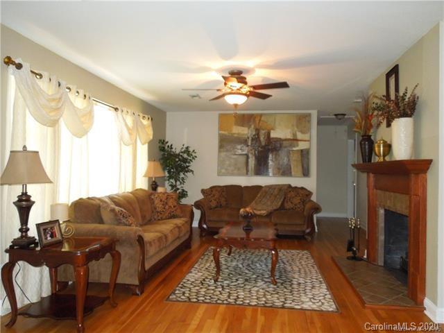 5531 Hickory Grove Road Charlotte, NC 28215 - Photo 7 of 24 a living room with furniture and a fireplace