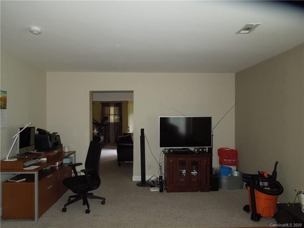 5531 Hickory Grove Road Charlotte, NC 28215 - Photo 8 of 24 a living room with furniture and a flat screen tv