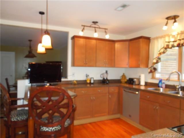 5531 Hickory Grove Road Charlotte, NC 28215 - Photo 9 of 24 a kitchen with a sink cabinets and window