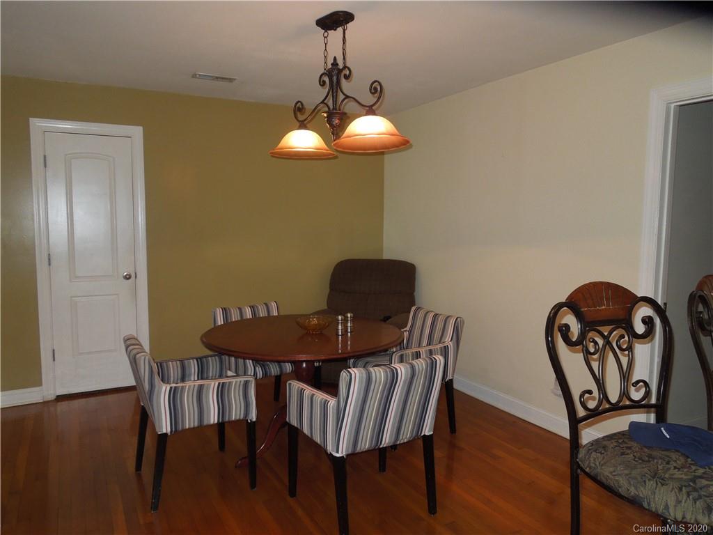 5531 Hickory Grove Road Charlotte, NC 28215 - Photo 10 of 24 a view of a dining room with furniture and wooden floor