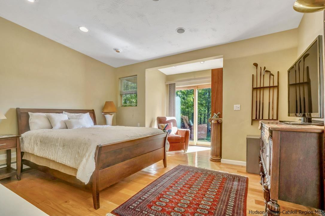 71 Carly Road Woodstock, NY 12498 - Photo 12 of 34 a bedroom with a bed and a couch