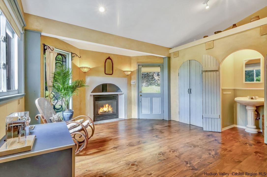 71 Carly Road Woodstock, NY 12498 - Photo 15 of 34 a living room with furniture and a fireplace