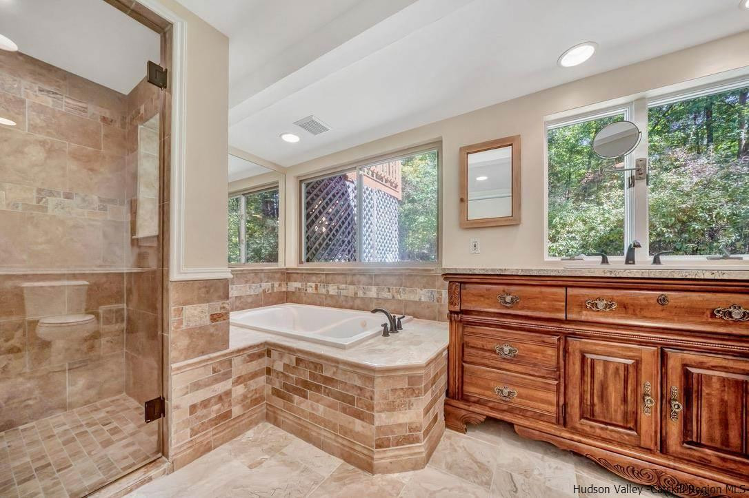 71 Carly Road Woodstock, NY 12498 - Photo 17 of 34 a spacious bathroom with a tub sink and mirror