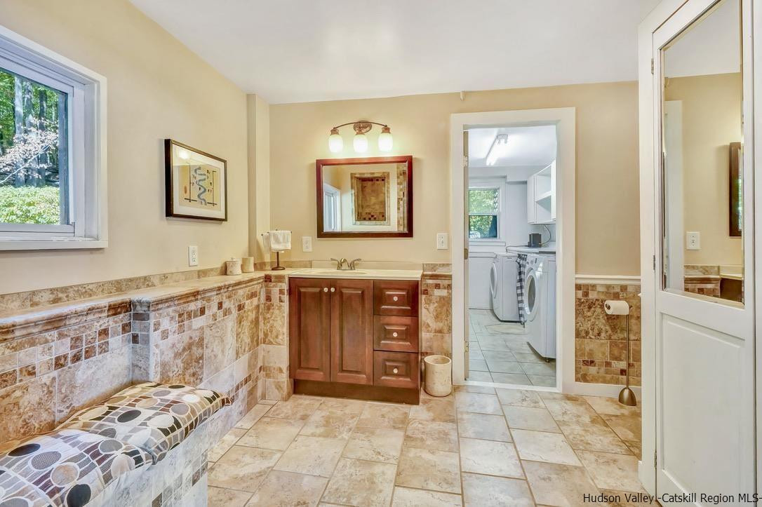 71 Carly Road Woodstock, NY 12498 - Photo 19 of 34 a bathroom with a tub sink and mirror