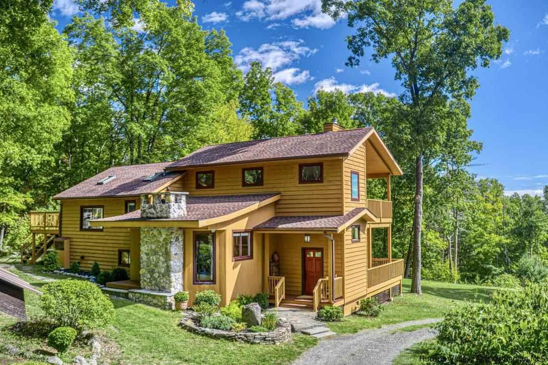 71 Carly Road Woodstock, NY 12498 - Photo 2 of 34 a front view of a house with garden