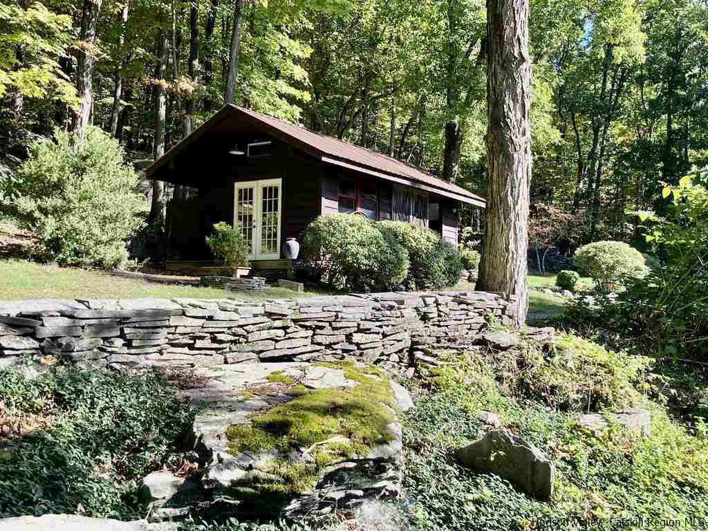 71 Carly Road Woodstock, NY 12498 - Photo 32 of 34 a front view of house with yard and trees in the background