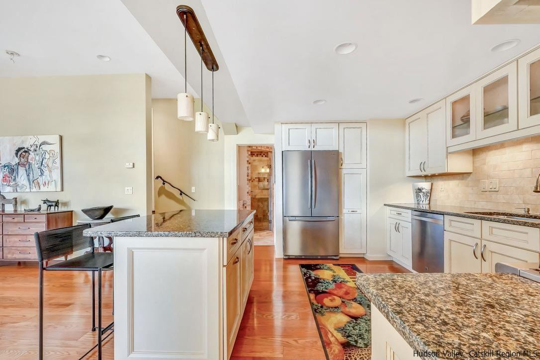 71 Carly Road Woodstock, NY 12498 - Photo 9 of 34 a kitchen with stainless steel appliances granite countertop a refrigerator and a stove top oven