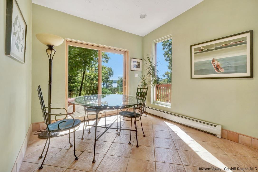 71 Carly Road Woodstock, NY 12498 - Photo 10 of 34 a dining room with furniture and large window